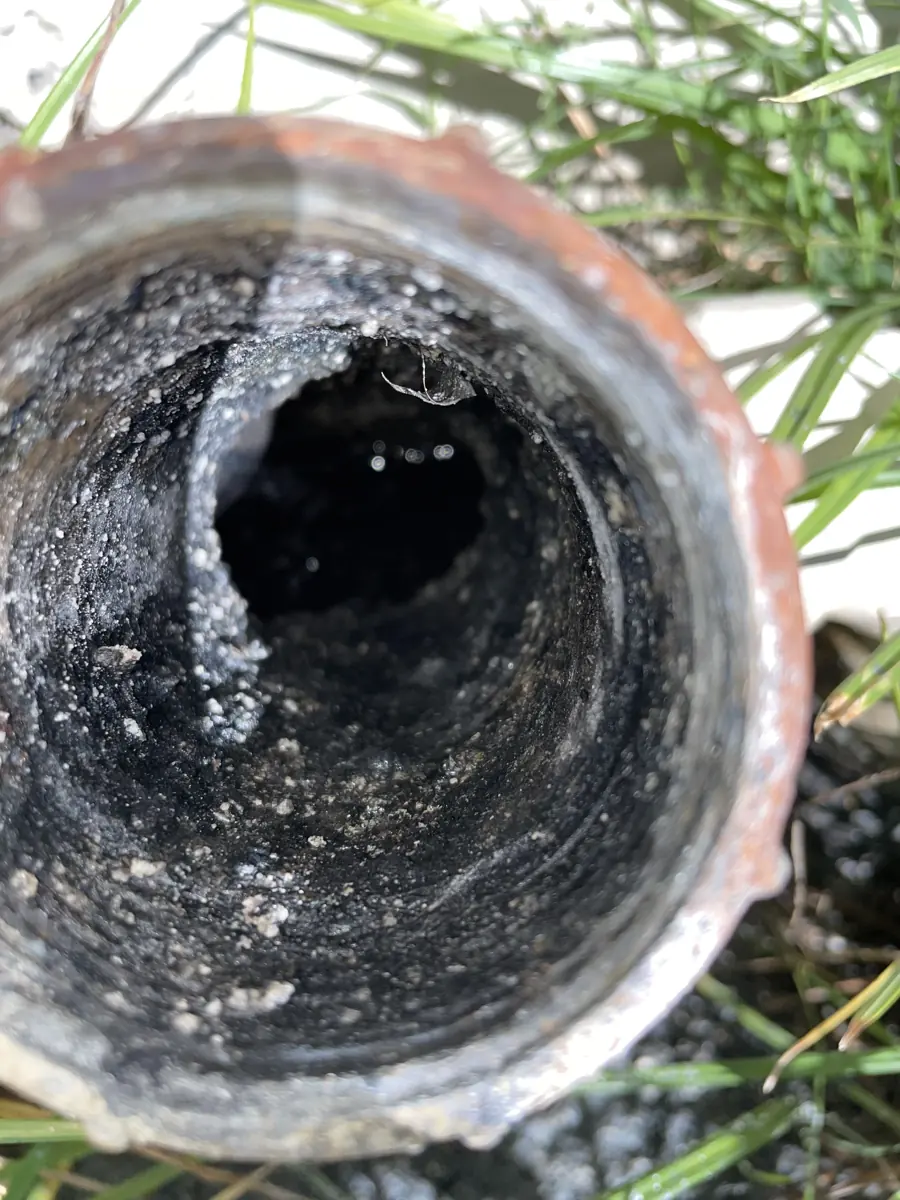 Inside an old, worn-out sewer pipe
