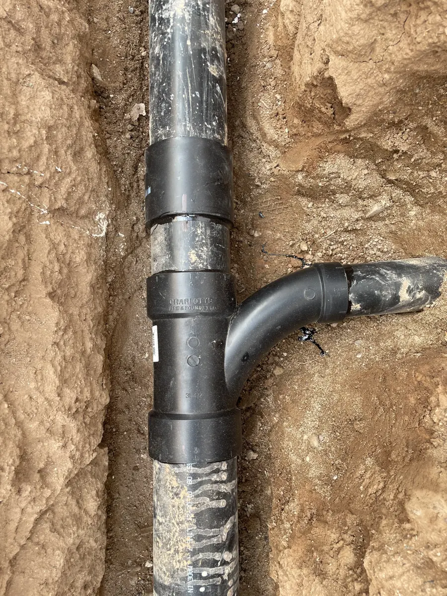 New sewer pipe tied in at the trench