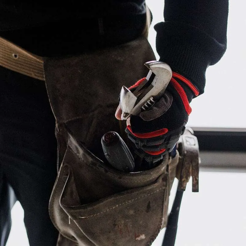 Plumber with a tool belt ready for the job